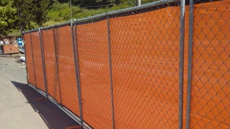 Portable rental fencing in lot of construction site