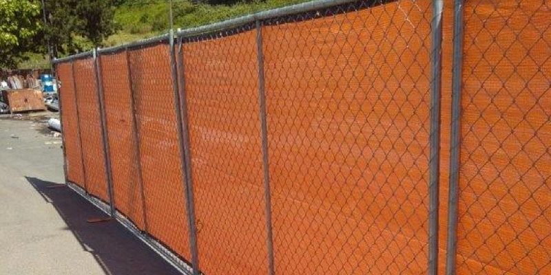Portable rental fencing in lot of construction site